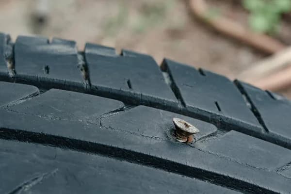 depositphotos_411018488-stock-photo-head-metal-screws-nails-embroidered